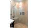 This modern shower displays neutral tiling, glass surround, and a built-in toiletry shelf at 2401 Ne Greenglade Rd, Atlanta, GA 30345