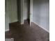 Cozy bedroom featuring soft carpet, neutral walls, and a double door closet at 2756 Norfair Loop, Lithonia, GA 30038