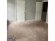The bedroom features neutral carpet and two white doors at 2756 Norfair Loop, Lithonia, GA 30038