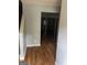 Inviting entryway featuring sleek hardwood floors and neutral gray walls, leading to spacious living areas at 2756 Norfair Loop, Lithonia, GA 30038