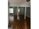 Open-concept living area with wood floors, neutral walls, and ample natural light, perfect for entertaining at 2756 Norfair Loop, Lithonia, GA 30038