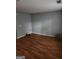 This living room features stylish hardwood floors and a neutral paint scheme at 2756 Norfair Loop, Lithonia, GA 30038