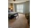 Comfortable bedroom with a queen bed, bedside table, and a chair at 2756 Norfair Loop, Lithonia, GA 30038