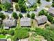 Aerial view of the home, showcasing the roof and surrounding trees at 5825 Trailwood Ct, Suwanee, GA 30024