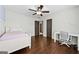 Comfortable bedroom features a ceiling fan, and a sunny window at 5825 Trailwood Ct, Suwanee, GA 30024