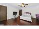 Large bedroom features hardwood floors, a ceiling fan, and plenty of space at 5825 Trailwood Ct, Suwanee, GA 30024