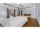 Bedroom with ensuite bath, hardwood floors, tray ceiling and abundant space at 5825 Trailwood Ct, Suwanee, GA 30024