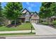 Attractive two-story brick home with landscaped front yard, mature trees and an inviting driveway at 5825 Trailwood Ct, Suwanee, GA 30024