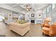 Open-concept living room with fireplace, hardwood floors, and coffered ceilings at 5825 Trailwood Ct, Suwanee, GA 30024