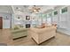 Bright living room with fireplace, coffered ceilings, and hardwood floors at 5825 Trailwood Ct, Suwanee, GA 30024