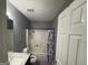 Bathroom with a tub, toilet, and single vanity at 5400 Twin Lakes Dr, South Fulton, GA 30349