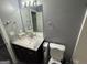 Bathroom with a dark vanity and toilet at 5400 Twin Lakes Dr, South Fulton, GA 30349