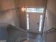 Entryway with stairs, a hanging light fixture, and a front door with sidelights providing ample natural light at 5400 Twin Lakes Dr, South Fulton, GA 30349
