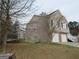 Side view of a two-story home, showcasing its architecture and yard at 5400 Twin Lakes Dr, South Fulton, GA 30349