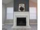 Living room fireplace with a white mantel, marble accents, and a dark accent wall creating a focal point at 5400 Twin Lakes Dr, South Fulton, GA 30349