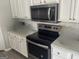 Modern kitchen appliances and fixtures with stylish countertops and cabinets at 5400 Twin Lakes Dr, South Fulton, GA 30349