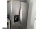 Stainless steel refrigerator with water and ice dispenser in modern kitchen at 5400 Twin Lakes Dr, South Fulton, GA 30349