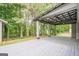 Large covered deck with metal roof and wood floor, perfect for outdoor entertaining at 4959 Abbotts Glen Nw Trl, Acworth, GA 30101