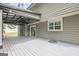 Spacious back deck with covered area, sliding door access to home, and backyard view at 4959 Abbotts Glen Nw Trl, Acworth, GA 30101