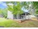 Backyard featuring a deck, house and a well-maintained lawn, ideal for Gathering enjoyment at 4959 Abbotts Glen Nw Trl, Acworth, GA 30101