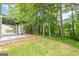 View of the backyard, deck and trees offering space for outdoor activities at 4959 Abbotts Glen Nw Trl, Acworth, GA 30101