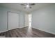 This bedroom features a closet, a door and stylish wood-look flooring at 4959 Abbotts Glen Nw Trl, Acworth, GA 30101