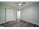 This bedroom features a closet, a door and stylish wood-look flooring at 4959 Abbotts Glen Nw Trl, Acworth, GA 30101