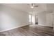 Spacious bedroom featuring a tray ceiling, ceiling fan, modern en-suite bath and natural light at 4959 Abbotts Glen Nw Trl, Acworth, GA 30101