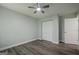 Light-filled bedroom featuring a closet, a door and stylish wood-look flooring at 4959 Abbotts Glen Nw Trl, Acworth, GA 30101