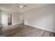 Spacious bedroom featuring a tray ceiling, ceiling fan, and modern en-suite bath at 4959 Abbotts Glen Nw Trl, Acworth, GA 30101