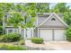 Charming two-story home with a well-manicured lawn and attached two-car garage at 4959 Abbotts Glen Nw Trl, Acworth, GA 30101