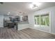 A modern kitchen featuring gray cabinets, stainless steel appliances, and granite countertops at 4959 Abbotts Glen Nw Trl, Acworth, GA 30101
