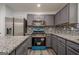 Updated kitchen features modern appliances and granite countertops at 4959 Abbotts Glen Nw Trl, Acworth, GA 30101