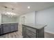 Spacious kitchen area featuring dual islands with granite countertops, grey cabinets, and wood-look floors at 4959 Abbotts Glen Nw Trl, Acworth, GA 30101