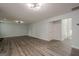 Open living room view with hardwood floors leading to the front door at 4959 Abbotts Glen Nw Trl, Acworth, GA 30101