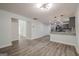 Open view to kitchen showing hardwood floors and ample lighting at 4959 Abbotts Glen Nw Trl, Acworth, GA 30101