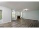Spacious living room with a cozy brick fireplace and wood flooring at 4959 Abbotts Glen Nw Trl, Acworth, GA 30101