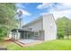 Exterior rear view showcasing a spacious yard, stylish deck, and charming home design at 4959 Abbotts Glen Nw Trl, Acworth, GA 30101