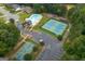 Aerial view of neighborhood amenities featuring a pool, tennis and basketball courts, and playground at 192 Sandhurst Ct, Suwanee, GA 30024