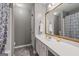 Bathroom with white sink and wooden framed mirror at 192 Sandhurst Ct, Suwanee, GA 30024