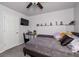 Cozy bedroom with a ceiling fan, tv, and gray carpet at 192 Sandhurst Ct, Suwanee, GA 30024