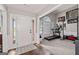 Welcoming foyer with hardwood floors, white trim, and ample natural light at 192 Sandhurst Ct, Suwanee, GA 30024