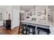 Stylish kitchen island offering seating, stainless appliances, and granite countertops at 192 Sandhurst Ct, Suwanee, GA 30024