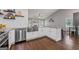 Gourmet kitchen showcasing stainless steel appliances, granite countertops, and custom cabinets at 192 Sandhurst Ct, Suwanee, GA 30024