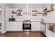 Spacious kitchen with stainless appliances, granite counters, and ample storage at 192 Sandhurst Ct, Suwanee, GA 30024