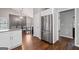 Bright kitchen showcasing stainless steel refrigerator and eat-in dining area at 192 Sandhurst Ct, Suwanee, GA 30024