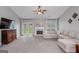 Cozy living room featuring a fireplace, mantel, and access to the backyard at 192 Sandhurst Ct, Suwanee, GA 30024