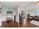 Open-concept living room with hardwood floors, large windows, and neutral paint scheme at 192 Sandhurst Ct, Suwanee, GA 30024