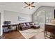 Cozy office with hardwood floors, a large window, and comfortable seating at 192 Sandhurst Ct, Suwanee, GA 30024