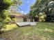 Charming home with a spacious backyard with deck, perfect for outdoor entertaining at 10173 Brass Ring Rd, Jonesboro, GA 30238